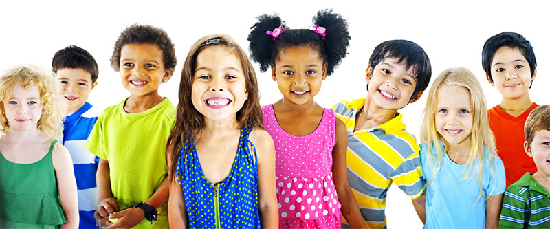 The image shows a group of children with various skin tones, hair colors, and styles, wearing colorful clothing, posing for a photo with smiles on their faces.